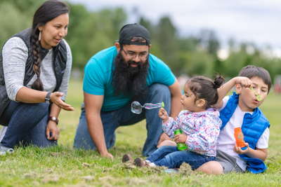 Photo of a family sitting on grass