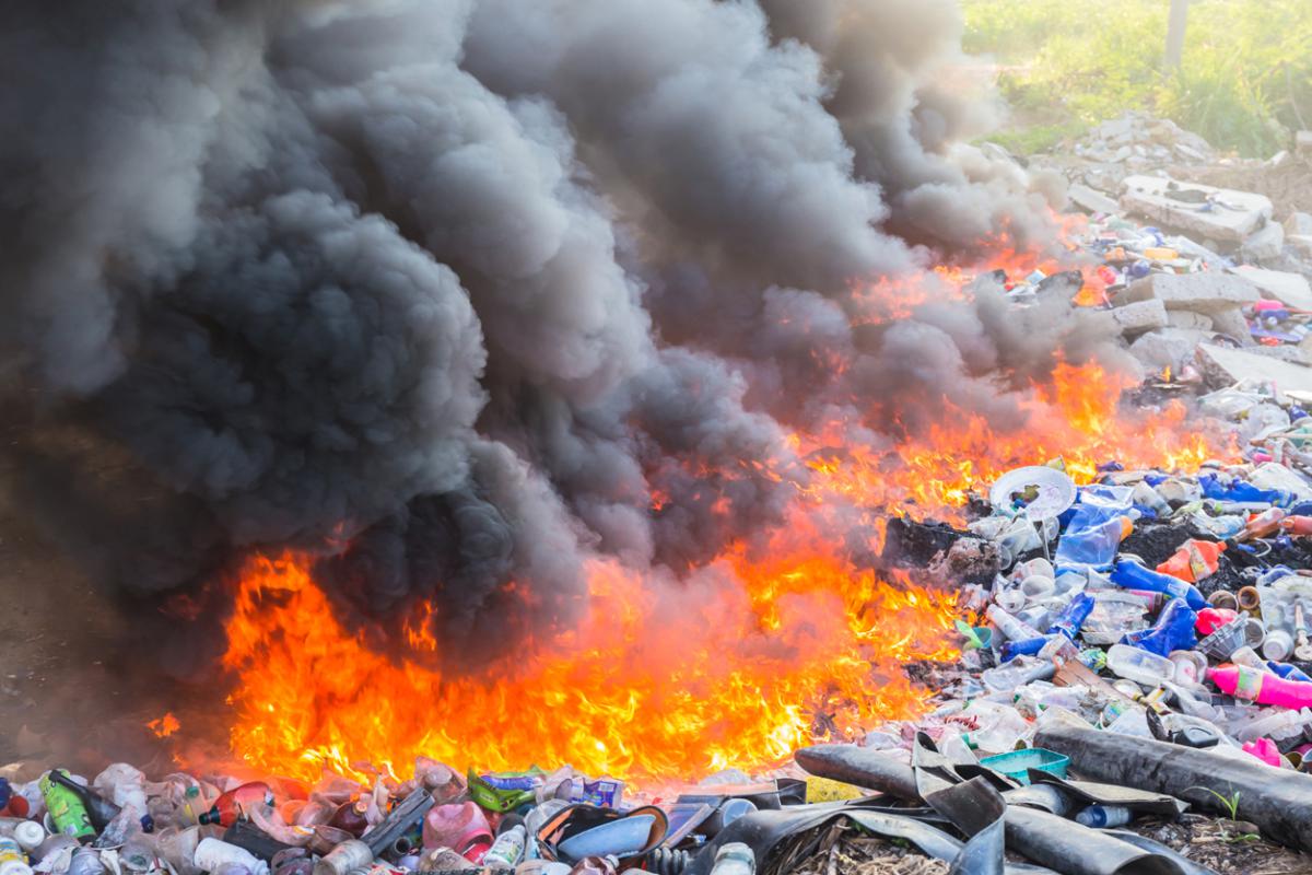 Photo of a large fire burning waste. Photo courtesy of 123graphic/Shutterstock.com 