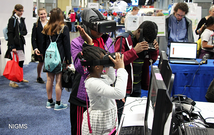 Three kids using VR headsets